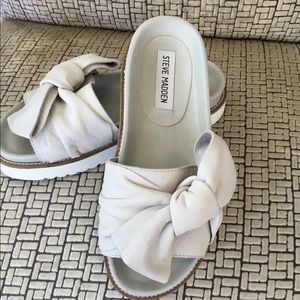 Steve Madden white knotted slides.